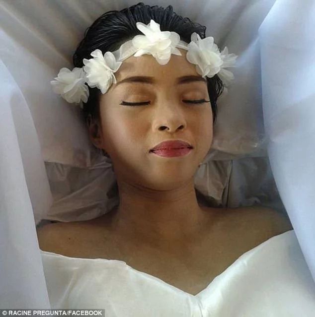 Racine Pregunta pictured in her coffin during her funeral Racine Pregunta pictured in her coffin during her funeral