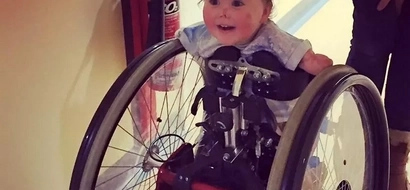 Miracle toddler take first steps on walking frame after losing legs and arms to meningitis