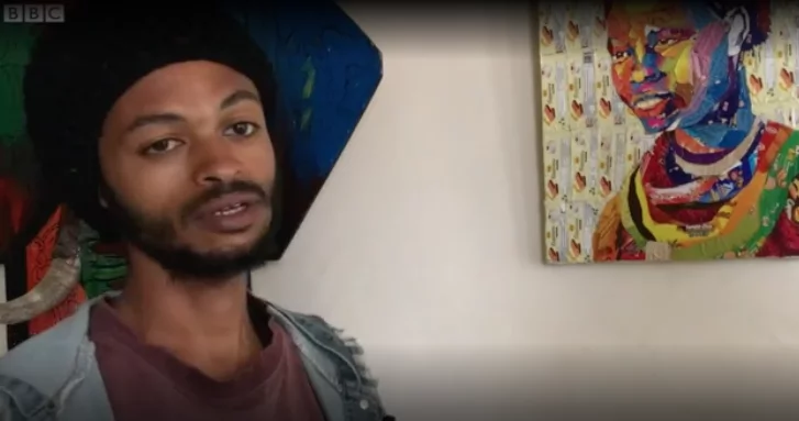 Estifanos Belay shows of one of his paintings. Photo: BBC Africa Estifanos Belay shows of one of his paintings. Photo: BBC Africa