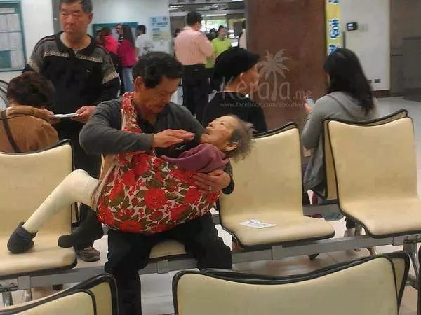 Touching photo of man feeding his senile mother Touching photo of man feeding his senile mother