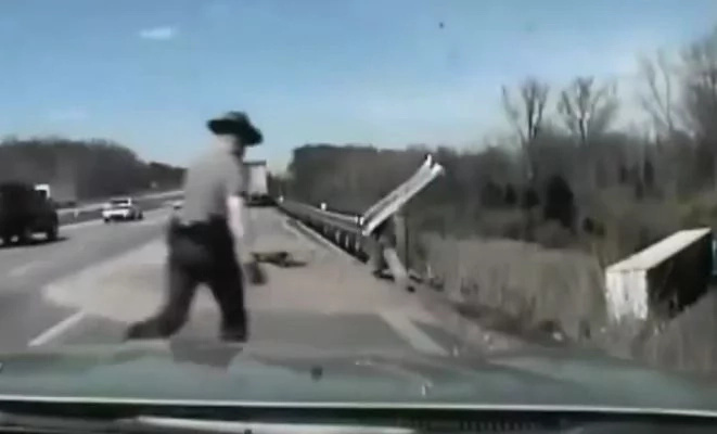 Officer Devers rushing to the accident site Officer Devers rushing to the accident site