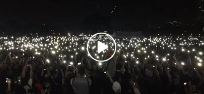 Parang yung sa Hogwarts! Anti-Marcos activists raise their lit mobile phones as a sign of protest in "Black Friday" rally