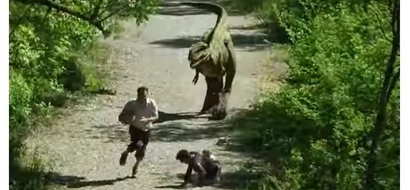 Man Surprised to See A Dinosaur Came Out From A Bushy Area