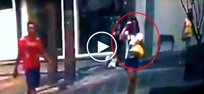Dangerous Pinoy snatcher steals expensive phone from female pedestrian in EDSA
