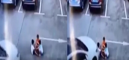 The car ran over kids playing at the parking lot. Distracted woman was using her smartphone while driving