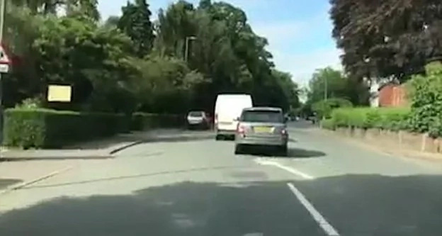 2 Enraged drivers in a road range race in a school street. Reckless driving caught by a motorist's dash cam. 2 Enraged drivers in a road range race in a school street. Reckless driving caught by a motorist's dash cam.