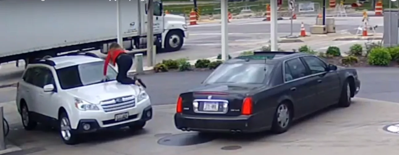 Woman stops car thief from driving away with her vehicle. She jumped on the hood unwilling to let go of her car... Woman stops car thief from driving away with her vehicle. She jumped on the hood unwilling to let go of her car...
