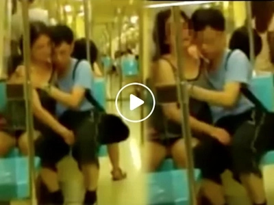 Indecent couple caught provocatively rubbing each other in train