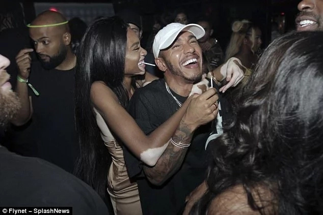 Winnie pictured partying with Formula 1 star Lewis Hamilton. Photo: Flynet/SpashNews Winnie pictured partying with Formula 1 star Lewis Hamilton. Photo: Flynet/SpashNews