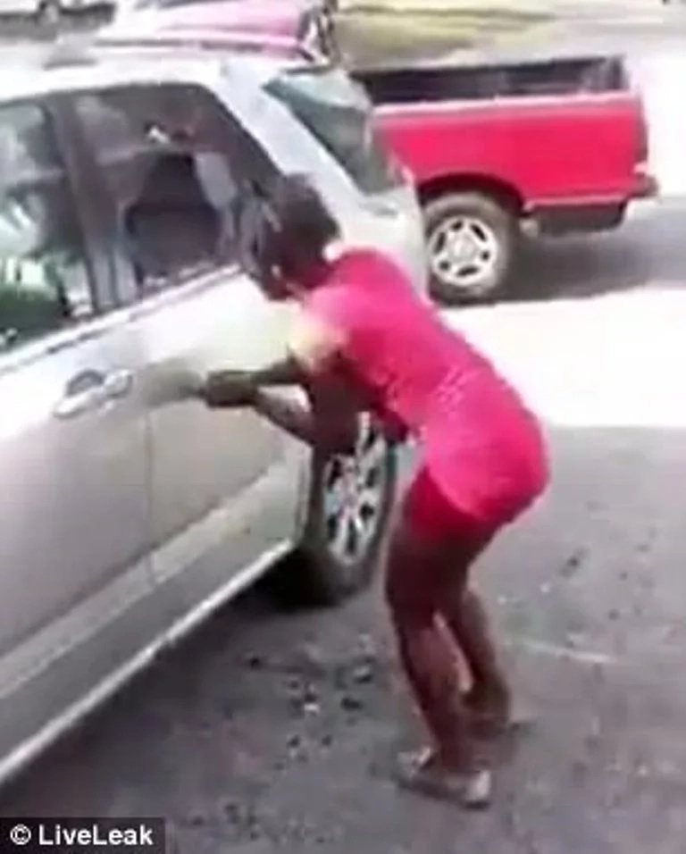 It's over 'beb'! Woman goes completely berserk, smashes ex-lover's car with hammer in REVENGE