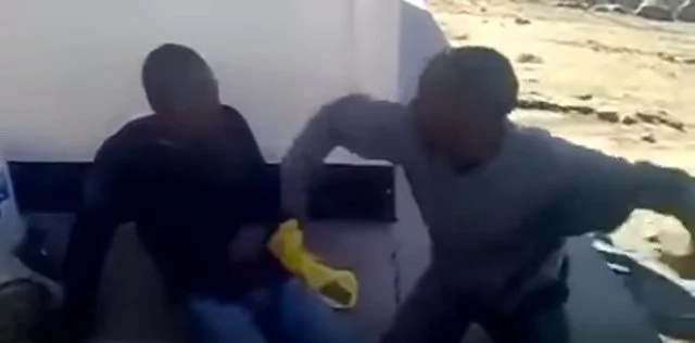 Two thieves are made to beat each other as punishment Two thieves are made to beat each other as punishment