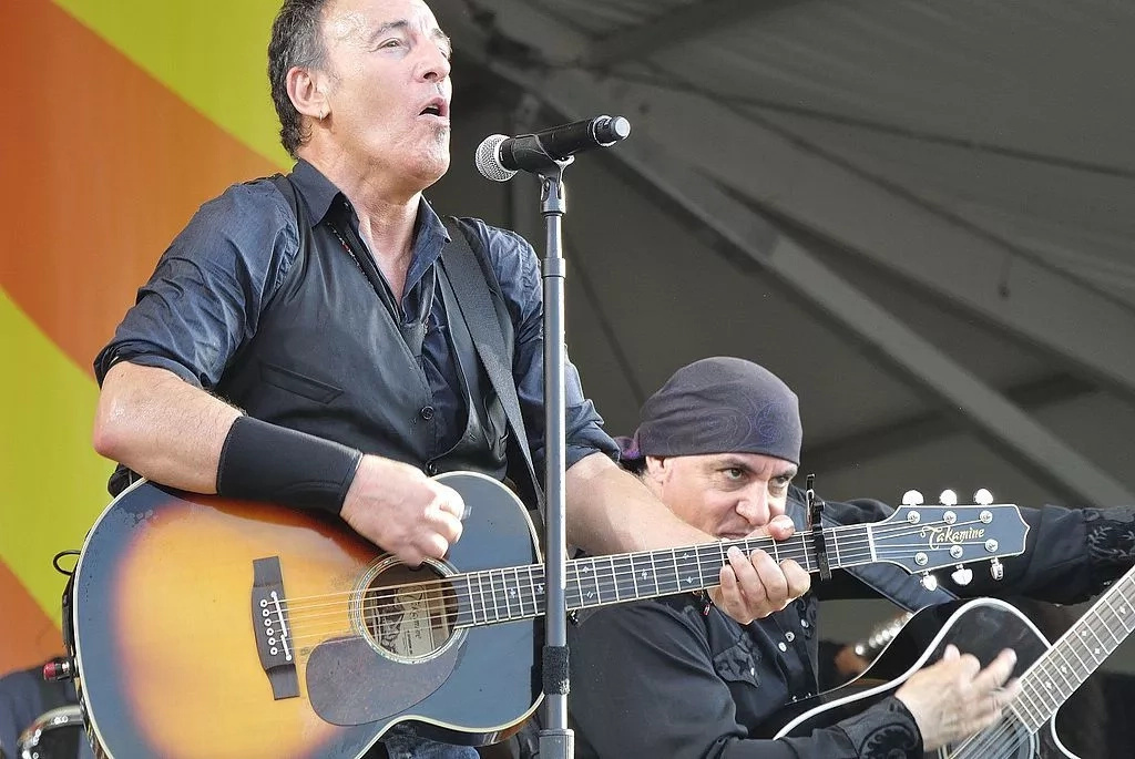 Bruce Springsteen performing on stage | Photo Getty Images