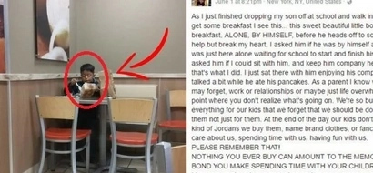A woman saw a boy eating alone. She came closer and asked about his parents, the child looked at her sadly.