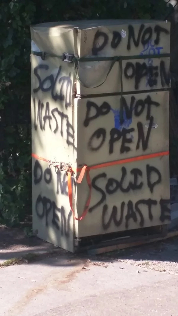 Someone left this fridge in the street 7 years ago. These guys decided to open it, ignoring the 'Do not open' sign on its side Someone left this fridge in the street 7 years ago. These guys decided to open it, ignoring the 'Do not open' sign on its side