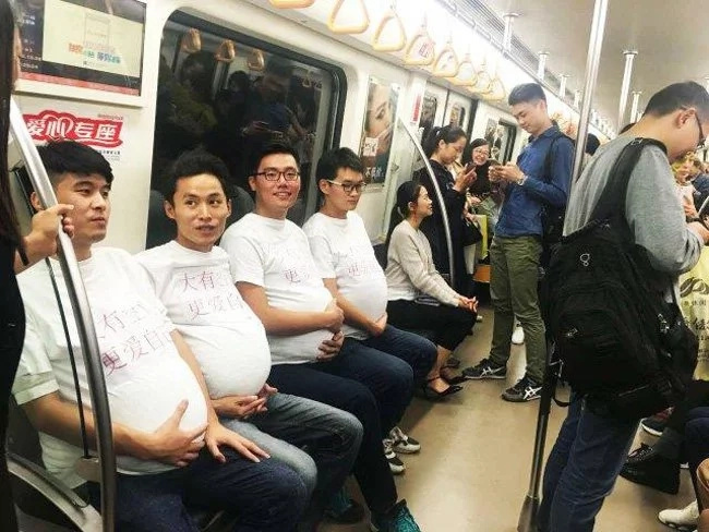 Are these men pregnant? No, they just support their wives! Are these men pregnant? No, they just support their wives!