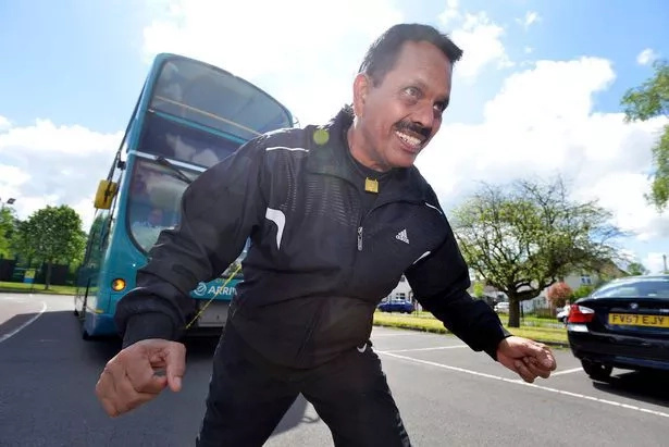 Grandad breaks own world record, pulls giant bus with ponytail