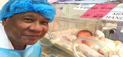 Photos of President Duterte meeting his new grandson nicknamed 'Stonefish' at the hospital gone viral
