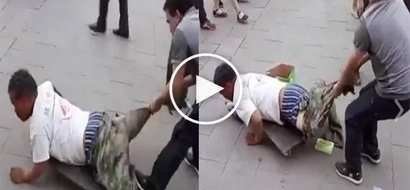 Passersby were shocked of a man pulling off a crippled man’s trouser! but what happened next surprised them more!