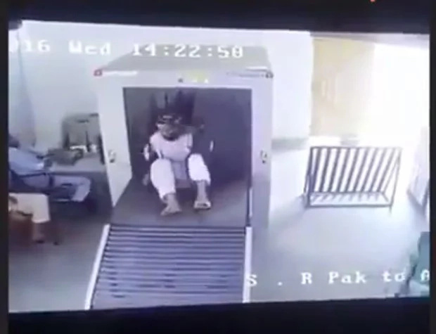 Guy gets inside the X-ray machine with his luggage Guy gets inside the X-ray machine with his luggage