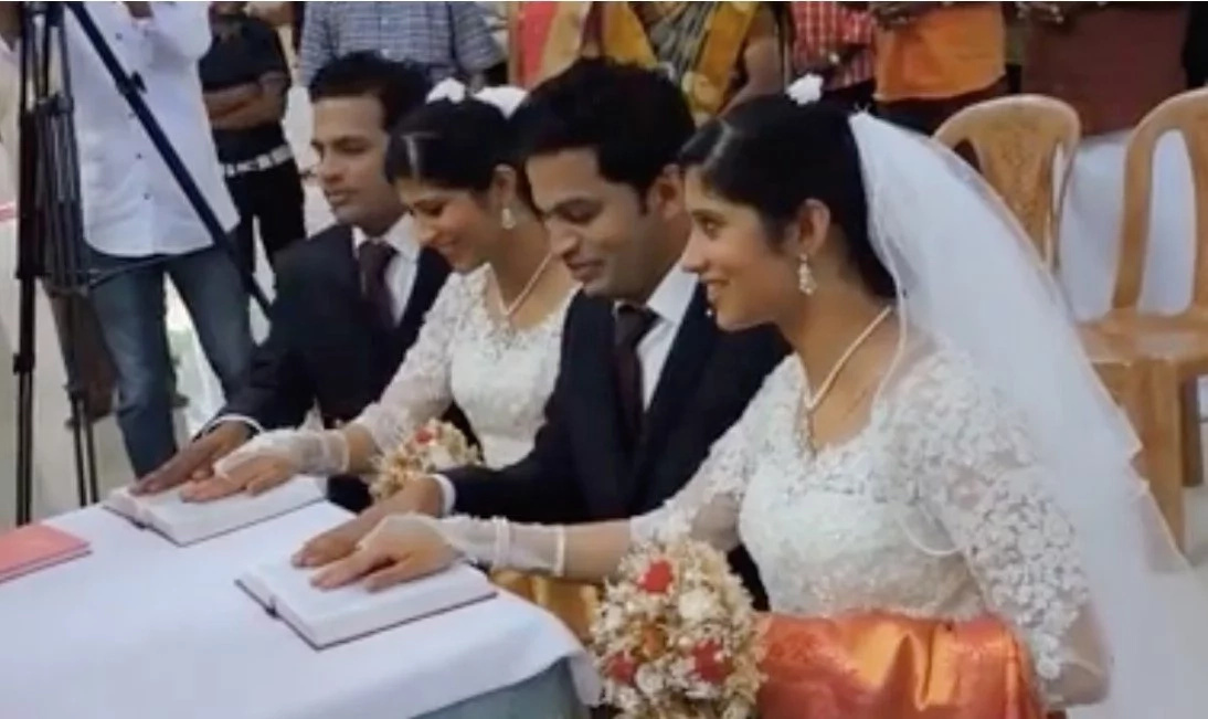 Twin brides marry twin grooms in wedding with twin priests and twin flower girls Twin brides marry twin grooms in wedding with twin priests and twin flower girls