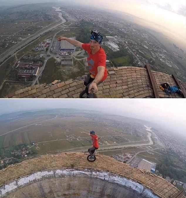 Man with deathwish rides UNICYCLE and perform tricks on 250m chimney Man with deathwish rides UNICYCLE and perform tricks on 250m chimney