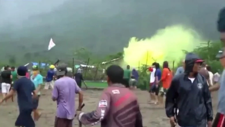 Poor fishermen use stones to defend their homes from Virata and Sy demolition forces Poor fishermen use stones to defend their homes from Virata and Sy demolition forces