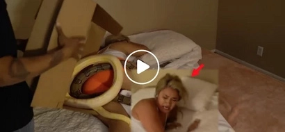 Sleeping girl in shock after two large snakes are put on top of her