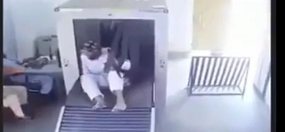 This guy takes airport check-in to the next level by getting in the X-ray machine with his luggage!