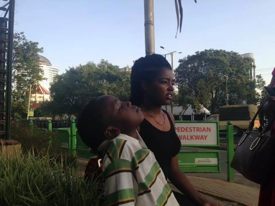 Woman saves child outside safaricom Woman saves child outside safaricom