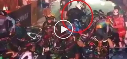 Motorcycle rider causes massive pile-up during intense bicycle race