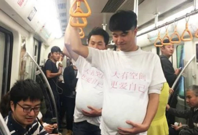 Are these men pregnant? No, they just support their wives! Are these men pregnant? No, they just support their wives!