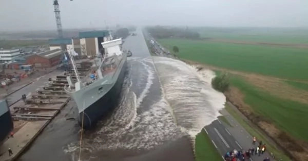 A New Launch Ship Created An Enormous Splashed As Two Small Boats Brought It Into The Water. Watch The Full Video Of How It Happened. A New Launch Ship Created An Enormous Splashed As Two Small Boats Brought It Into The Water. Watch The Full Video Of How It Happened.