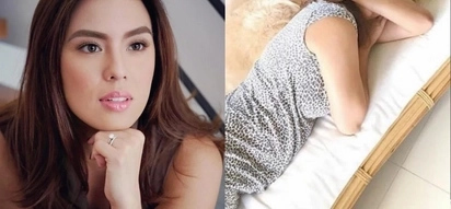 Is Nikki Gil sporting a baby bump in this photo?
