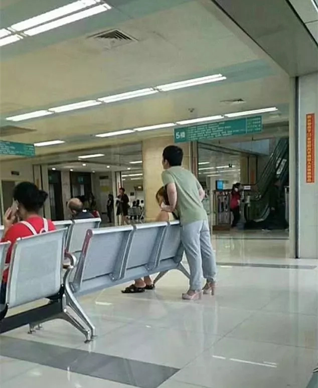 The considerate boyfriend wore his girlfriend's high heels. Photo: AsiaWire The considerate boyfriend wore his girlfriend's high heels. Photo: AsiaWire