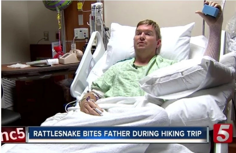 Decapitated Snake Head Bites Guy After He Cuts Its Head Off Decapitated Snake Head Bites Guy After He Cuts Its Head Off
