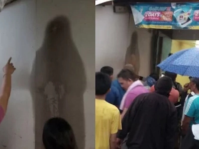 Miracle or creepy? People are worshiping this black figure on the wall that looks like Mama Mary