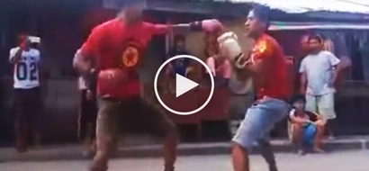 Careless Pinoy street fighter gets knocked out cold by his rival during boxing match