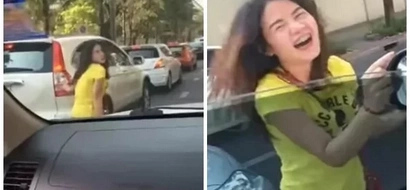 Beautiful girl spotted dancing right in the traffic jam
