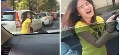Beautiful girl spotted dancing right in the traffic jam
