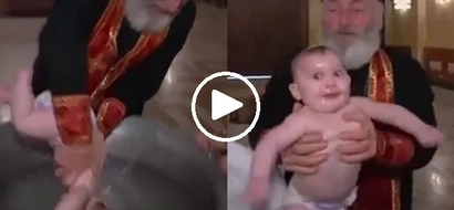 Ang tinding binyag naman nito! Video of babies being baptized in Georgia will make your head spin