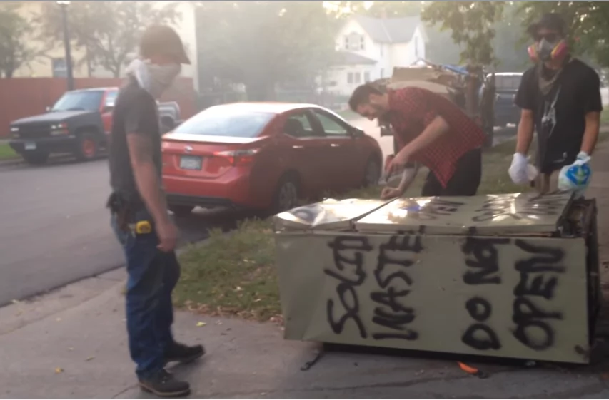 Someone left this fridge in the street 7 years ago. These guys decided to open it, ignoring the 'Do not open' sign on its side Someone left this fridge in the street 7 years ago. These guys decided to open it, ignoring the 'Do not open' sign on its side