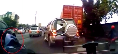Careless Pinoy rider gets run over by SUV after crashing his motorbike in Manila