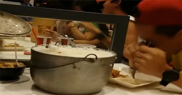 Boy enjoys extra rice at KFC by bringing own rice pot Boy enjoys extra rice at KFC by bringing own rice pot