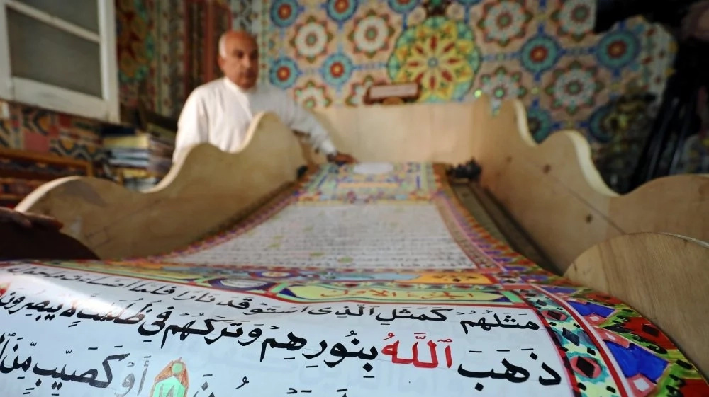 Man spends 3 years rewriting Quran on 700 metre paper scroll Man spends 3 years rewriting Quran on 700 metre paper scroll