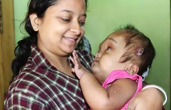 Dying child outlives parents' predictions about her life Dying child outlives parents' predictions about her life