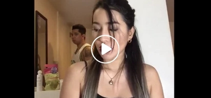 Over protective boyfriend disrupts girl's video blog to make an adjustment