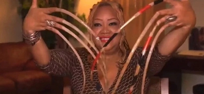 Her fingernails are over 26 inches long - Here is why she did it