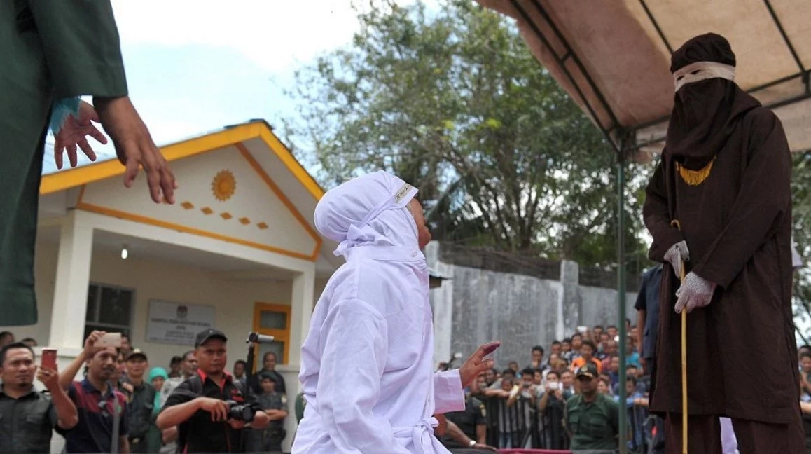 Man And Woman Publicly Caned Until They Collapse For Being Intimate Outside Of Marriage Photos