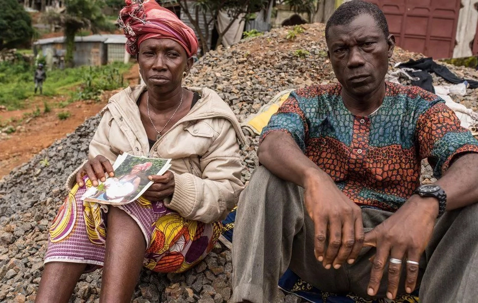 Yatta Kamara (left) lost 14 members of her family. Photo: BBC Yatta Kamara (left) lost 14 members of her family. Photo: BBC