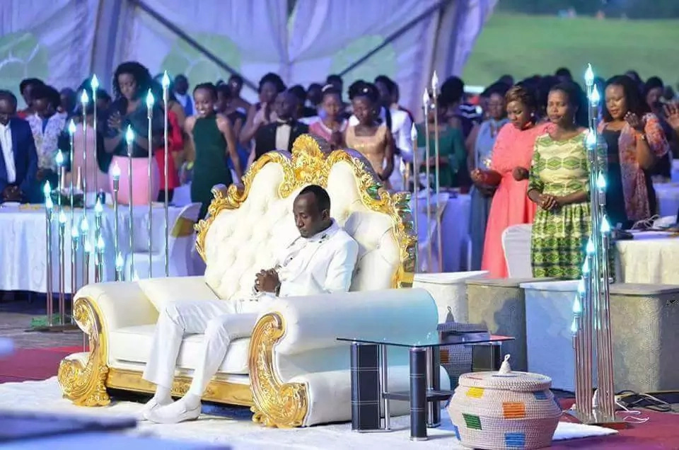 Flamboyant pastor whose congregants worship him by kissing his feet (photos)